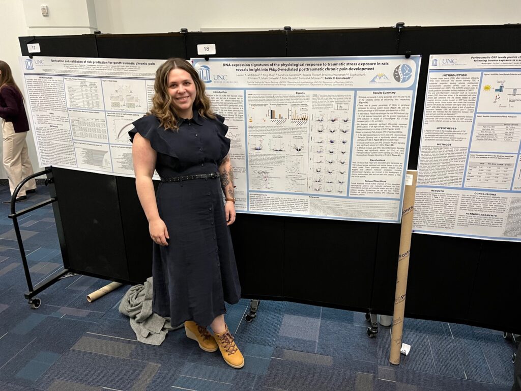 Dr. McKibben, in front of her research poster after presenting