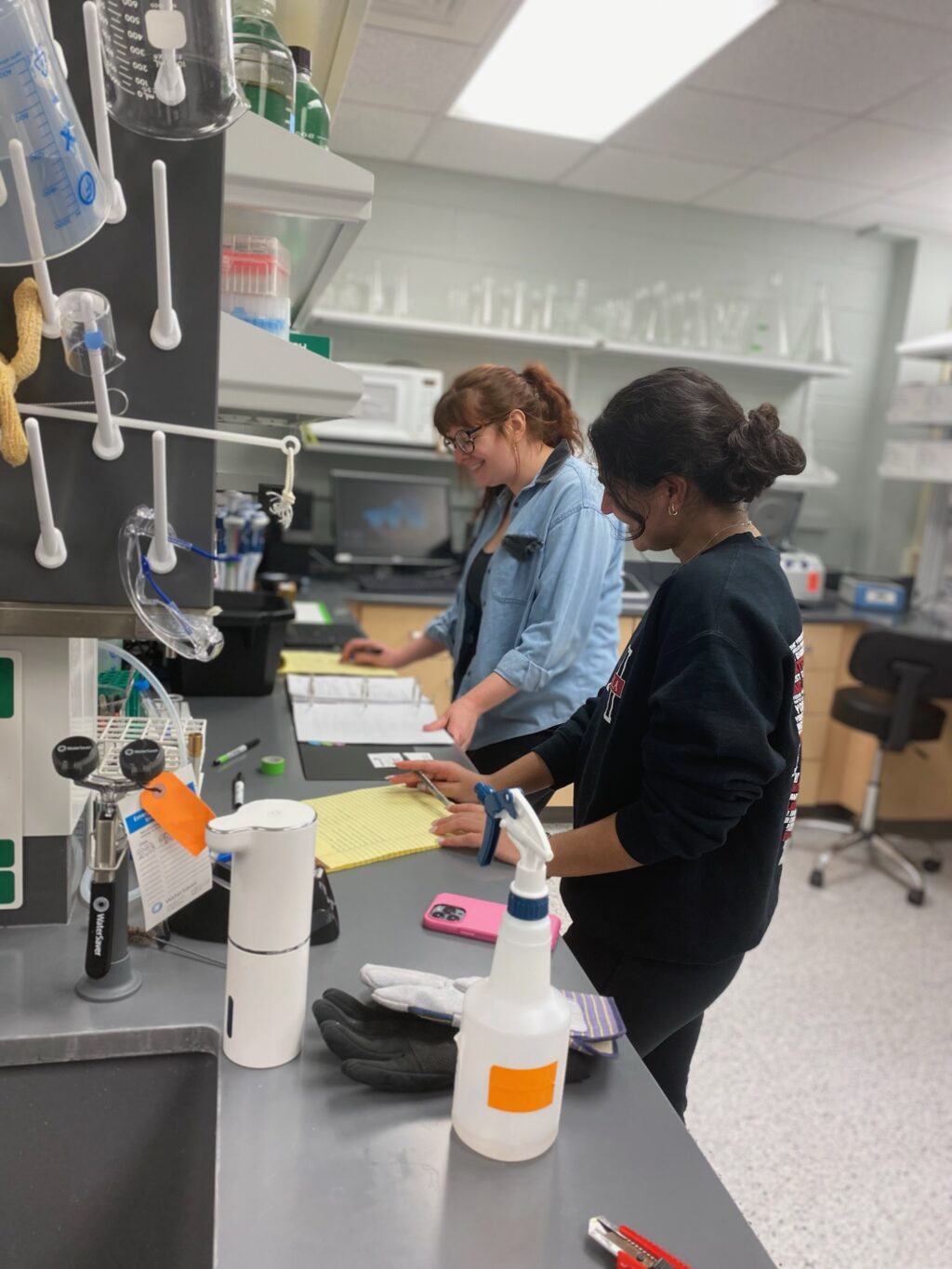 Graduate Student, Erica Branham and Lab member conducting a wet lab