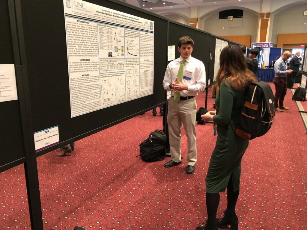 Lab Member trainee presenting research poster