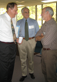 Physiology's Dr. James Faber (at right) speaks with Dr. William Greenlee (center), President and CEO of The Hamner Institutes, and Dr. Charles Hamner (left), Chairman of the Hamner's Board of Trustees.