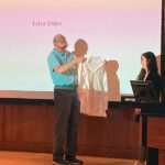 Dr. Henrik Dohlman presents Selin Altinok her Pharmacology white coat at her white coat ceremony after her defense.