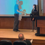 Dr. Henrik Dohlman presents Selin Altinok her Pharmacology white coat at her white coat ceremony after her defense.